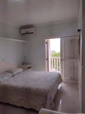 Uma cama ou camas num quarto em Residencial Everest em Bombinhas SC
