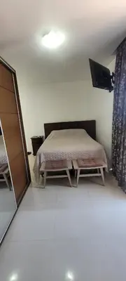 Uma cama ou camas num quarto em Apartamento frente Mar no Centro de Porto Belo