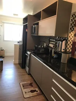 A cozinha ou kitchenette de Apartamento 2 quartos todo decorado Itapema bairro Meia Praia