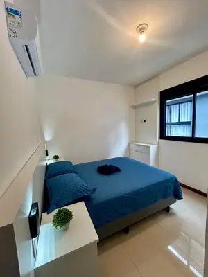Uma cama ou camas num quarto em Apê Ásia