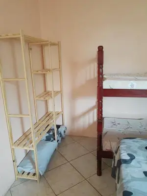 Uma cama ou camas num quarto em Casa em Bombinhas zimbros
