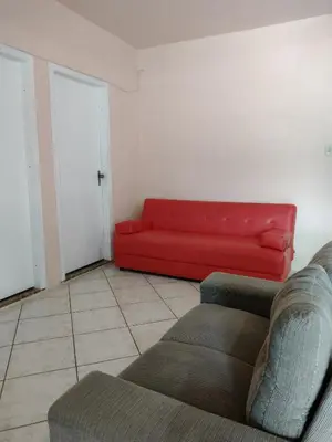 Uma área de estar em Casa em Bombinhas zimbros