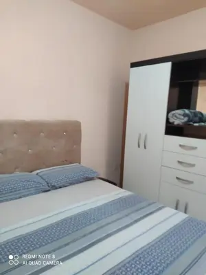 Uma cama ou camas num quarto em Casa em Bombinhas zimbros