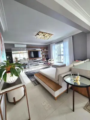 Uma cama ou camas num quarto em 4 suítes com vista mar na Meia Praia