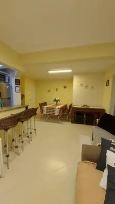 Uma área de estar em Residencial Villa Toscana - Apartamento Bombas 100M da Praia