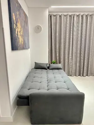 Uma área de estar em Edificio AUSTIN 179, 1 quarto 1 suite, garagem, wifi, Ar, churrasqueira, 600m da praia, 17 andar