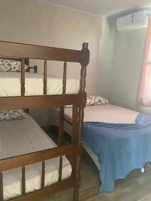 Uma cama ou camas num quarto em Residencial Canto da Maré