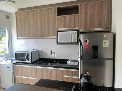 A cozinha ou kitchenette de Apartamento 500 metros da praia de Palmas