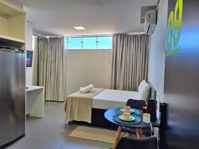 Uma cama ou camas num quarto em Loft Completo & Funcional na Barra BC |CURTA209