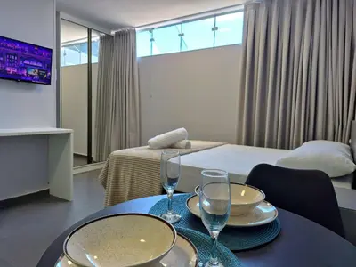Uma cama ou camas num quarto em Loft Completo & Funcional na Barra BC |CURTA209
