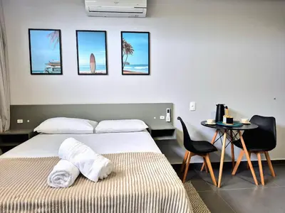 Uma cama ou camas num quarto em Loft Completo & Funcional na Barra BC |CURTA209