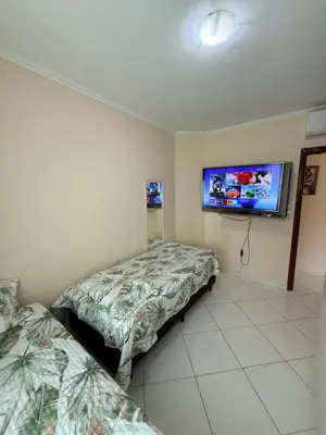 Uma cama ou camas num quarto em Departamento Brasil