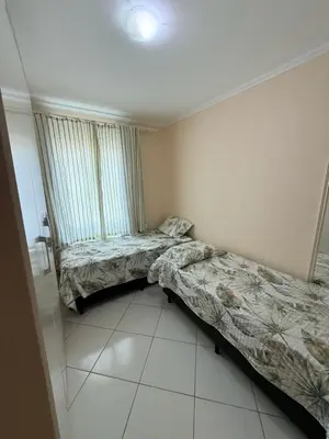 Uma cama ou camas num quarto em Departamento Brasil