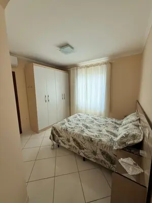 Uma cama ou camas num quarto em Departamento Brasil