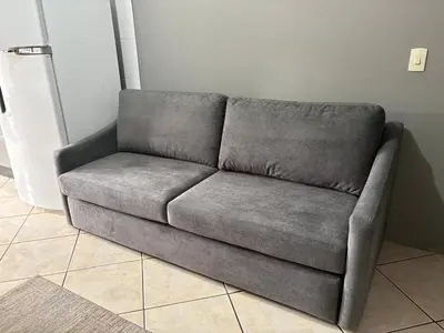 Uma área de estar em Casa em itapema fácil acesso e bem localizada