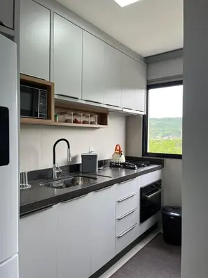 A cozinha ou kitchenette de Apartamento 400 metro distancia da Praia de Palmas - Governador Celso Ramos