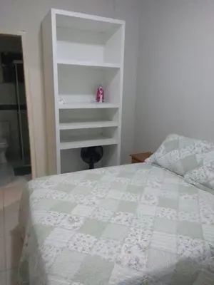 Uma cama ou camas num quarto em Apto térreo com um dormitório