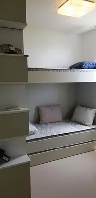 Uma cama ou camas num quarto em Alto Padrão na Meia Praia com 3 Garagens, Ar e WiFi