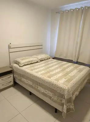 Uma cama ou camas num quarto em Apartamento térreo Canto Grande