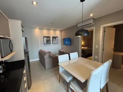 A cozinha ou kitchenette de Flat Itapema Perto do Mar - 1002