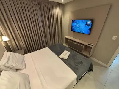 Uma cama ou camas num quarto em Flat Itapema Perto do Mar - 1002