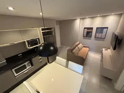 A cozinha ou kitchenette de Flat Itapema Perto do Mar - 1002