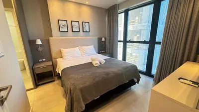 Uma cama ou camas num quarto em Flat Itapema Perto do Mar - 1002