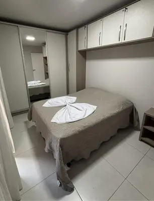 Uma cama ou camas num quarto em Apartamento térreo próximo Morro do Macaco e Centro Comercial 100m da Praia