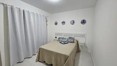 Uma cama ou camas num quarto em Apartamento Oasis de Palmas Seu paraiso na Praia