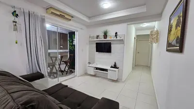 Uma televisão e/ou sistema de entretenimento em Apartamento Oasis de Palmas Seu paraiso na Praia