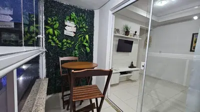 Uma televisão e/ou sistema de entretenimento em Apartamento Oasis de Palmas Seu paraiso na Praia