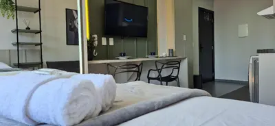 Uma cama ou camas num quarto em Loft Completo Vista Yachthouse |CURTA203