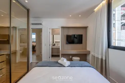 Uma cama ou camas num quarto em Aptos a apenas passos da Praia em Itapema - EAHs