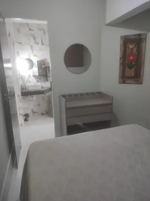 Uma cama ou camas num quarto em Pé na Areia com Garagem GRÁTIS 3 Quartos na Orla de Balneário Camboriú