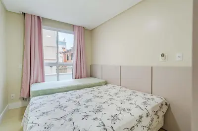 Uma cama ou camas num quarto em Porto Fino - Centro de Bombinhas SC
