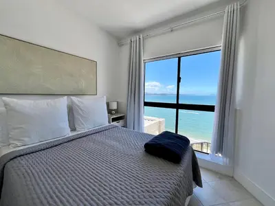 Uma cama ou camas num quarto em Cobertura Quebec Beira-Mar