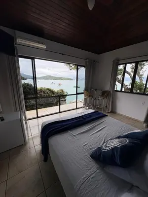 Uma cama ou camas num quarto em Caixa d aço residence