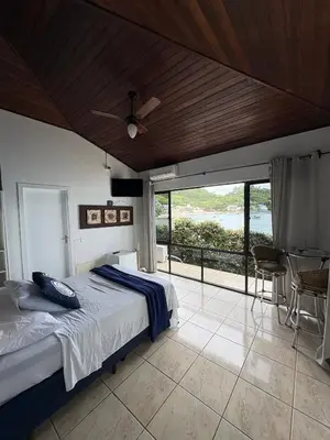 Uma cama ou camas num quarto em Caixa d aço residence