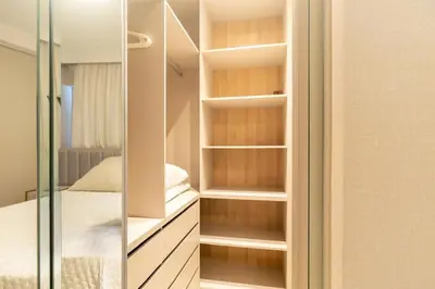 Uma cama ou camas num quarto em Departamento Premium Bombas Brasil