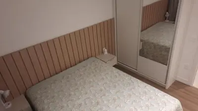 Uma cama ou camas num quarto em MEIA PRAIA Apartamento - Itapema