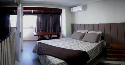 Uma cama ou camas num quarto em Apartamento aconchegante 100 metros do mar
