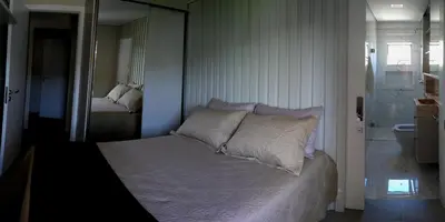 Uma cama ou camas num quarto em Apartamento aconchegante 100 metros do mar
