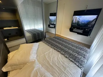 Uma cama ou camas num quarto em Edifício Arpoador Praia de Palmas - 250m da praia