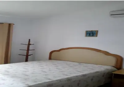 Uma cama ou camas num quarto em Casa em Palmas - 2 Min da Praia - Ideal para Família