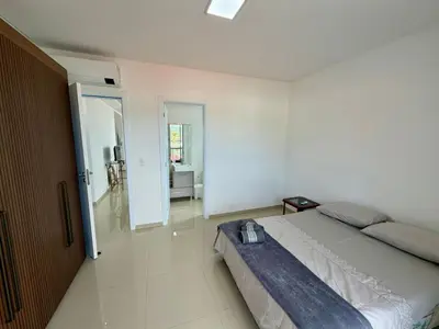 Uma cama ou camas num quarto em Paz e Conforto Seu Lar na Vila de Palmas