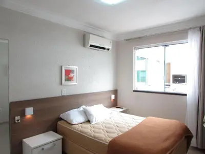 Uma cama ou camas num quarto em Bombinhas summer bech