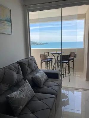 Uma área de estar em Hermoso apartamento con vista al Mar