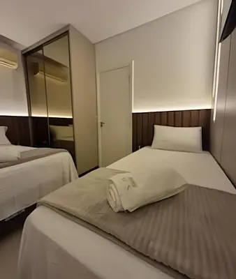 Uma cama ou camas num quarto em Apto Corsário com Piscina á 100m Praia Palmas/SC
