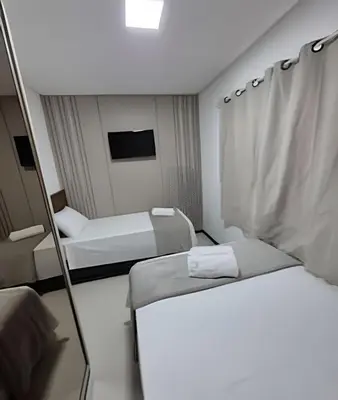 Uma cama ou camas num quarto em Apto Corsário com Piscina á 100m Praia Palmas/SC