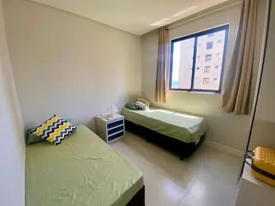 Uma cama ou camas num quarto em Oceana Suites Porto Belo